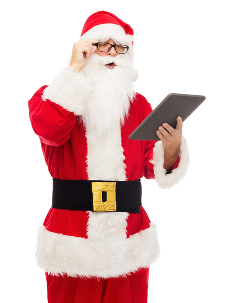 man in costume of santa claus with tablet pc - Zdjęcie, obraz