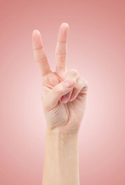 Hand with two fingers up in the peace or victory symbol - Fotó, kép