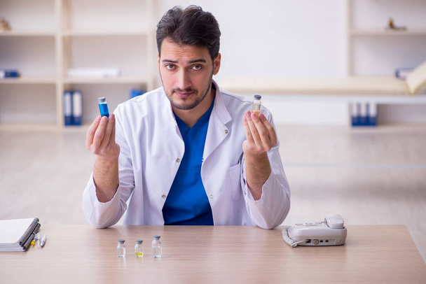 Young male doctor in vaccination concept - Photo, Image