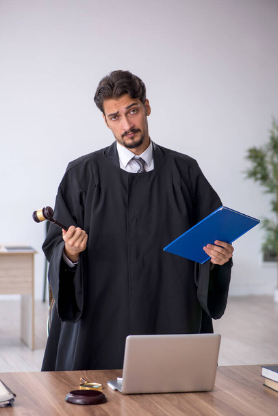 Young male judge working in the courthouse - Φωτογραφία, εικόνα