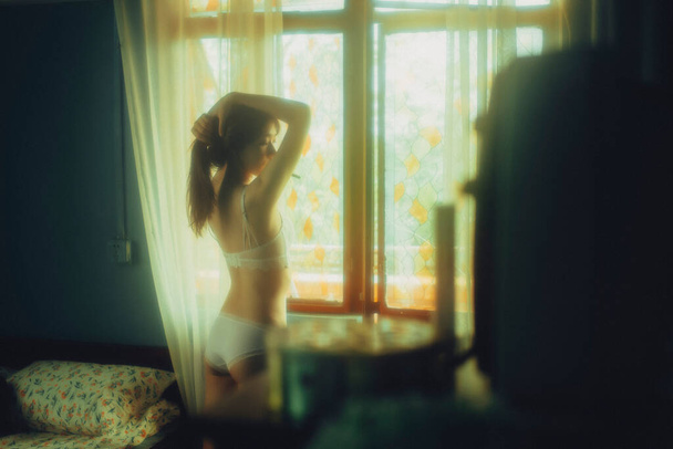 beautiful young woman in lingerie in the morning - 写真・画像