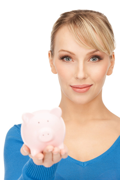 Lovely woman with piggy bank - Фото, изображение