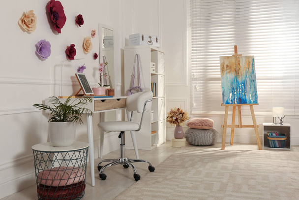 Stylish teenager's room interior with computer and painting easel - Photo, Image