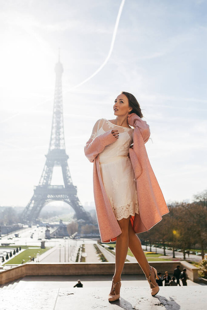 Beautiful girl on background of the Eiffel tower - Фото, зображення