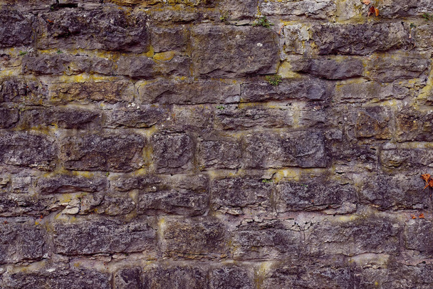 Texture of a stone wall. Old castle stone wall texture background. Stone wall as a background or texture. Part of a stone wall, for background or texture - Φωτογραφία, εικόνα
