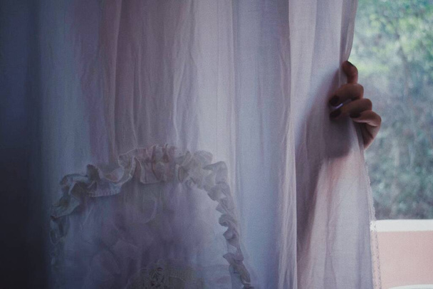 beautiful woman with veil on the window - Fotografie, Obrázek