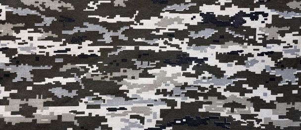 Fabric with texture of Ukrainian military pixeled camouflage. Cloth with camo pattern in grey, brown and green pixel shapes. Official uniform of Ukrainian soldiers close up - Photo, Image