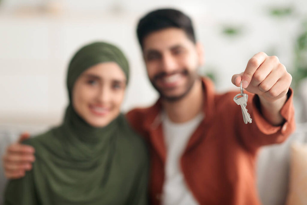 Young Middle Eastern Spouses Showing New House Key At Home - Photo, Image