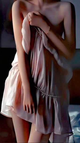 beautiful young woman in a black dress posing in the studio - Фото, зображення