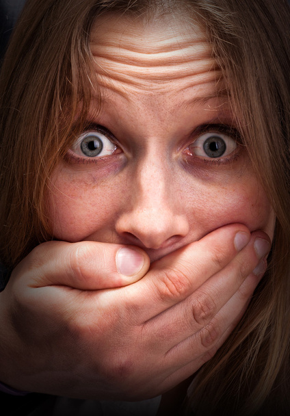 Afraid girl with closed mouth - Фото, изображение