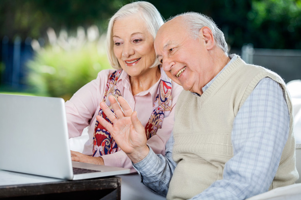 Elderly Couple Video Chatting On Laptop - Valokuva, kuva