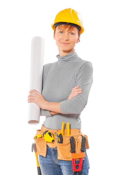 Female worker holding rolled up blueprint - Фото, изображение