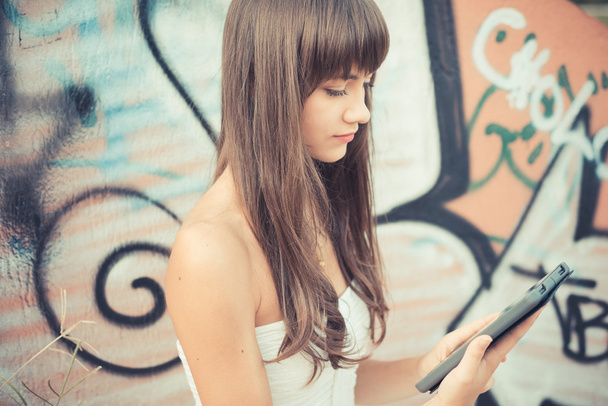 beautiful young woman with white dress using tablet  - Fotografie, Obrázek