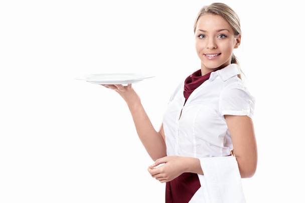 Attractive girl with an empty plate - Foto, Imagen