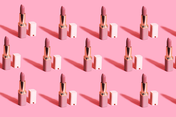 Nude matte lipstick with a cap on a pink background. Female accessory for lip makeup pattern. Professional cosmetic product for makeup artists in the composition. Backdrop. - Foto, afbeelding