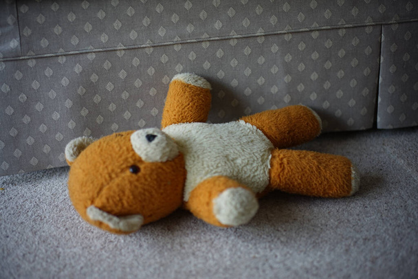 teddy bear with a toy on a wooden background - Фото, зображення