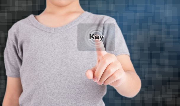 hand pushing on a touch screen interface "KEY" - Foto, imagen