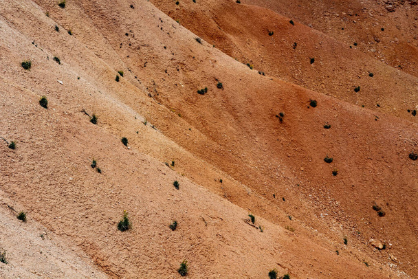 a closeup shot of a desert sand dunes - Fotó, kép