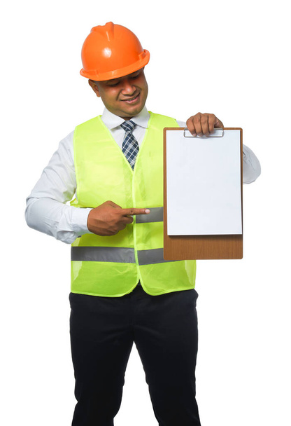 Portrait of a handsome chief engineer wearing a hard hat. Wearing a reflective tiger. Thumbs up. isolated on white background clipping path.copy space. - Фото, изображение