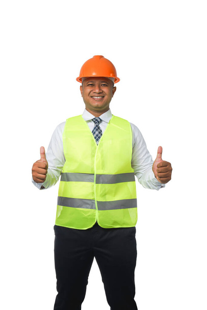 Portrait of a handsome chief engineer wearing a hard hat. Wear a reflective vest. isolated on a white background clipping path - Fotó, kép