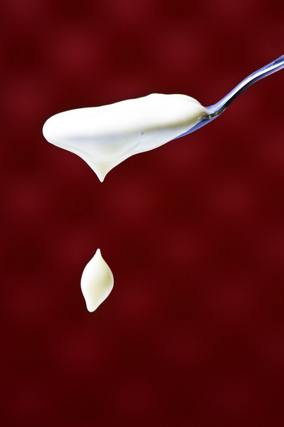 Spoon with yogurt - Fotó, kép