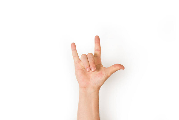 Mano de hombre haciendo gesto de amor en lenguaje de señas sobre un fondo blanco - Foto, imagen