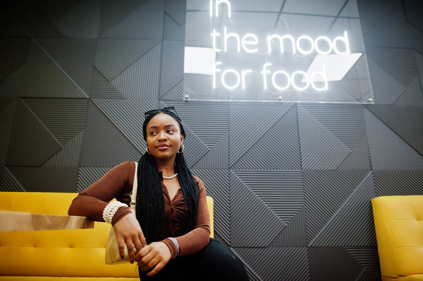 In the mood for food. African woman in cafe. - Foto, Imagem