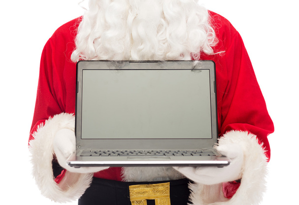 close up of santa claus with laptop - Fotó, kép
