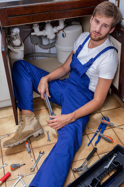 Tired man during sink repair - Foto, Imagem