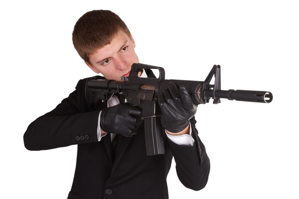 man in black costume and rifle - Фото, изображение