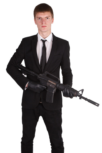 man in black costume and rifle - 写真・画像
