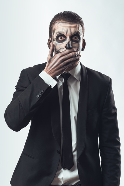 scared businesswoman with makeup skeleton - Foto, afbeelding
