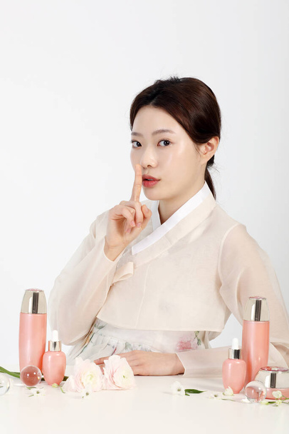 Asian Korean young woman wearing Hanbok Korean traditional clothes, cosmetics makeup beauty concept in studio - Φωτογραφία, εικόνα