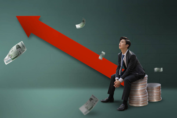 graphic poster of rise in interest rates, Korean young business man struggling with the loan interest - Photo, Image