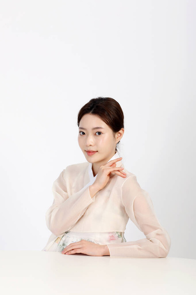 Asian Korean young woman wearing Hanbok Korean traditional clothes, beauty concept in studio - Fotó, kép
