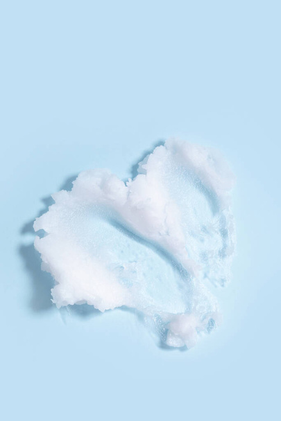 isolated smear beauty cosmetics texture of cleansing balm in blue background - Foto, Imagem