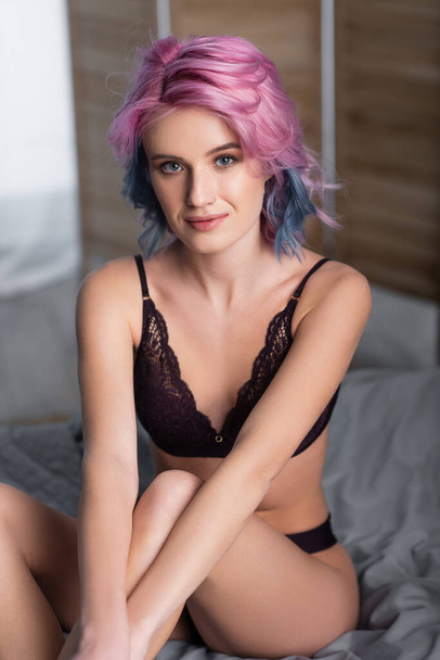 portrait of young woman in dark sexy lingerie looking at camera - Fotografie, Obrázek