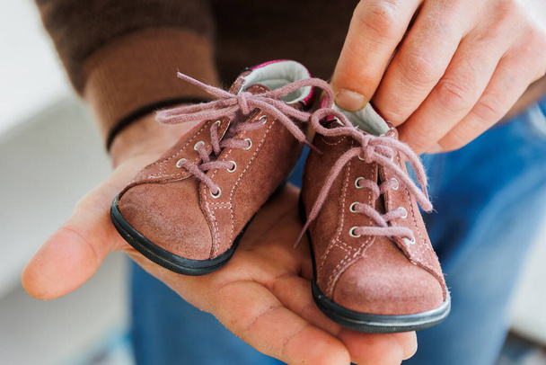 Close up, childrens crimson shoes. Birthday gift. - Фото, изображение