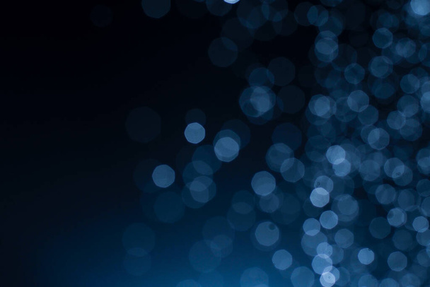 Dark blue abstract background with bokeh. Colorful twinkling lights bokeh light background. - Φωτογραφία, εικόνα