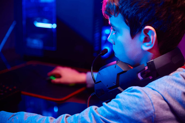 Boy plays computer game at home, gaming addiction - Фото, изображение