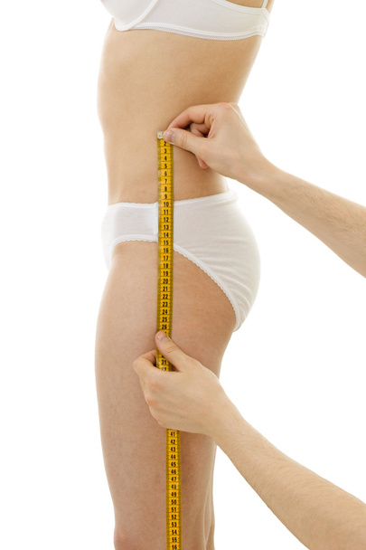 Measuring woman's hips size - Foto, Bild