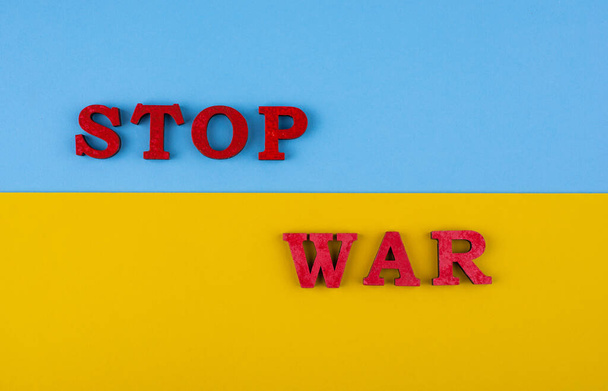 Stop war in Ukraine concept with flag colors - Foto, Bild