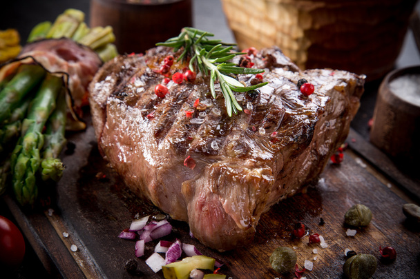Beef steak on wooden table - Φωτογραφία, εικόνα