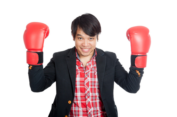 Asian man wear suit show boxing gloves - 写真・画像