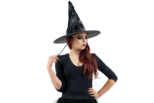 pretty young redhead witch, isolated against white background - Photo, Image