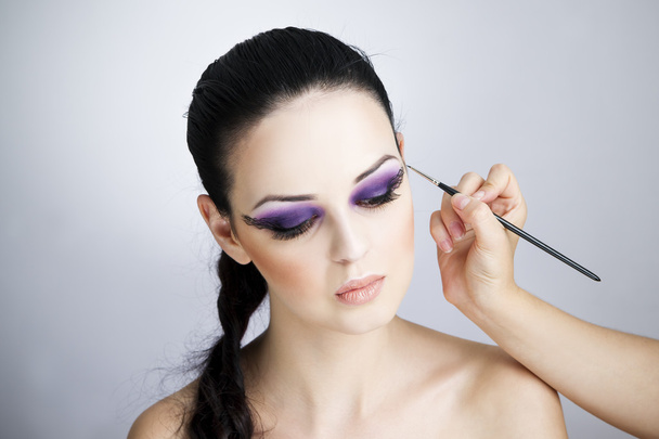 Professional makeup and hairstyle beautiful young woman close up - Fotó, kép