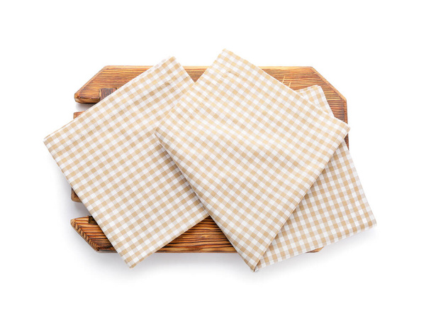 Wooden board with napkins on white background - Photo, Image