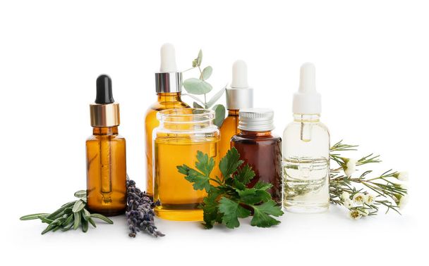 Bottles of natural essential oils on white background - Photo, Image