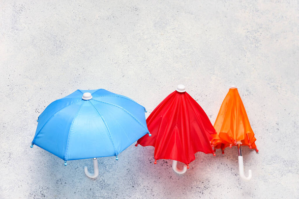 Different umbrellas on light background - Photo, Image