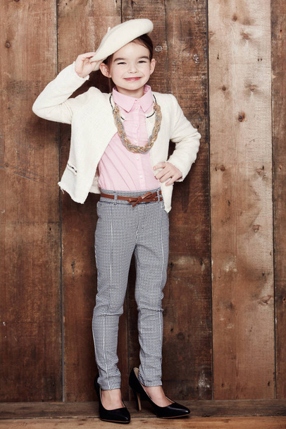 Bonjour. Portrait of an adorable little girl dressed fashionably in a cute beret. - Photo, Image